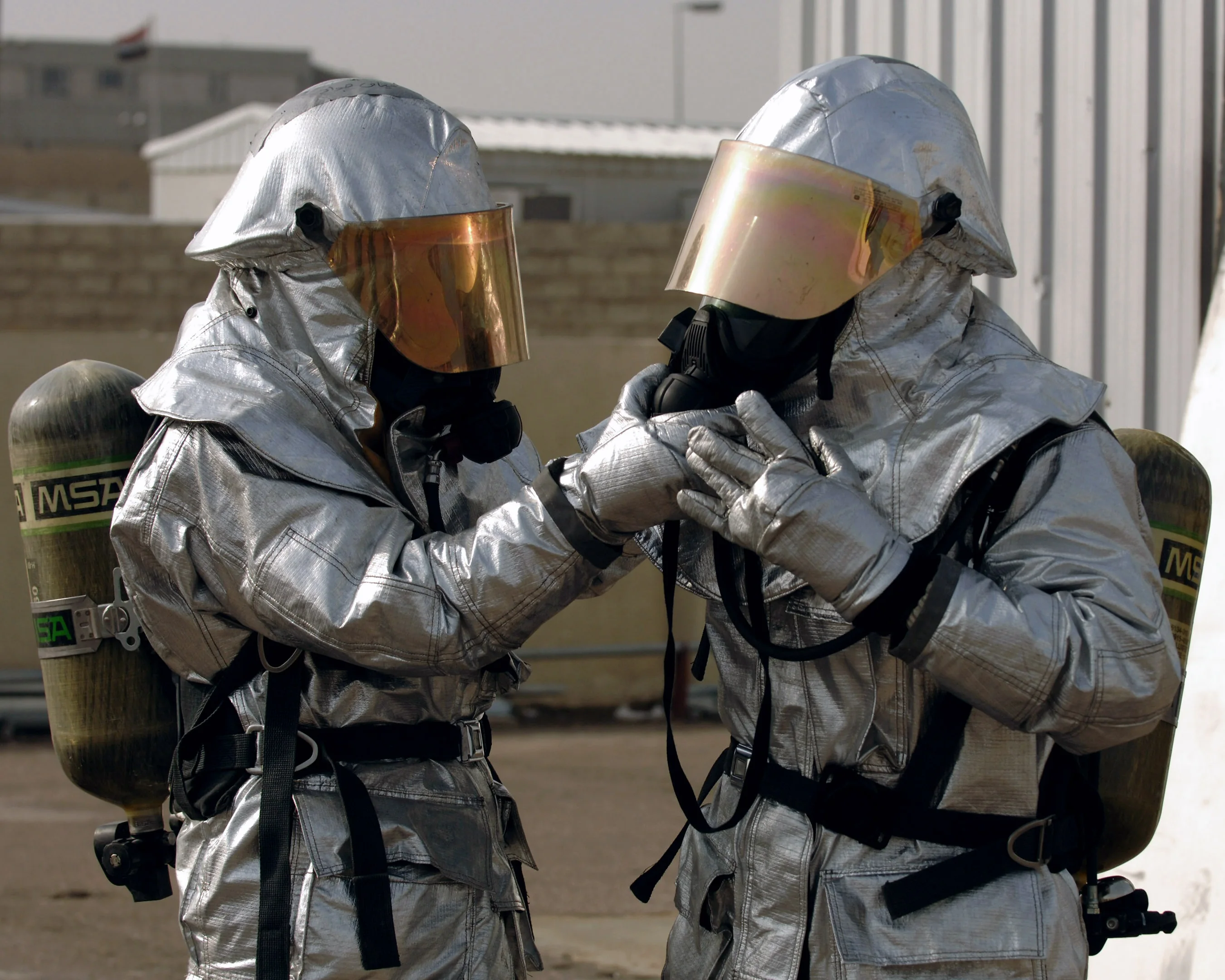Firefighters wearing full protective equipment