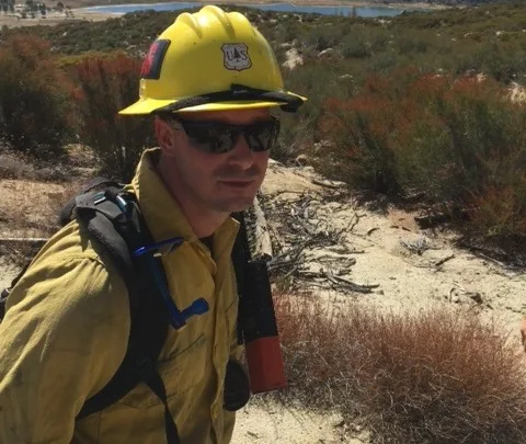 Safety professional wearing a hard hat and protective eyewear